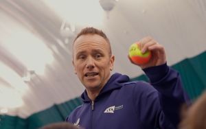 Coach, Mark Hayden holding up a ball during a session