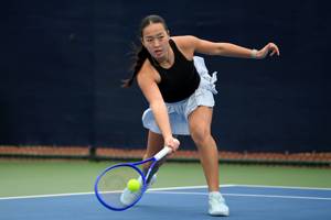 Annabel Wong reaching to pick up a forehand at the Lexus Junior National Championships