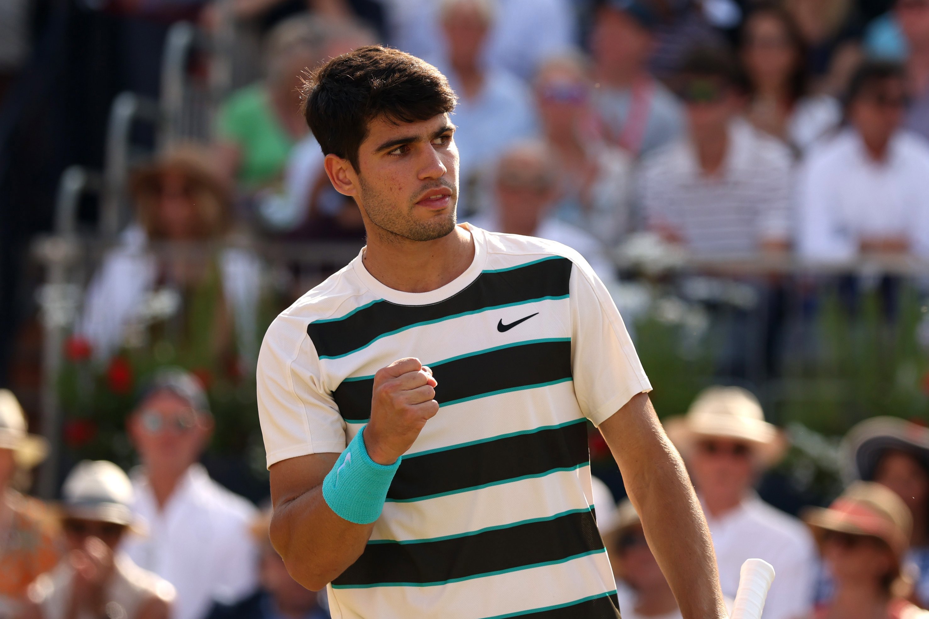 Carlos Alcaraz clenching his fist on court at the HSBC Championships