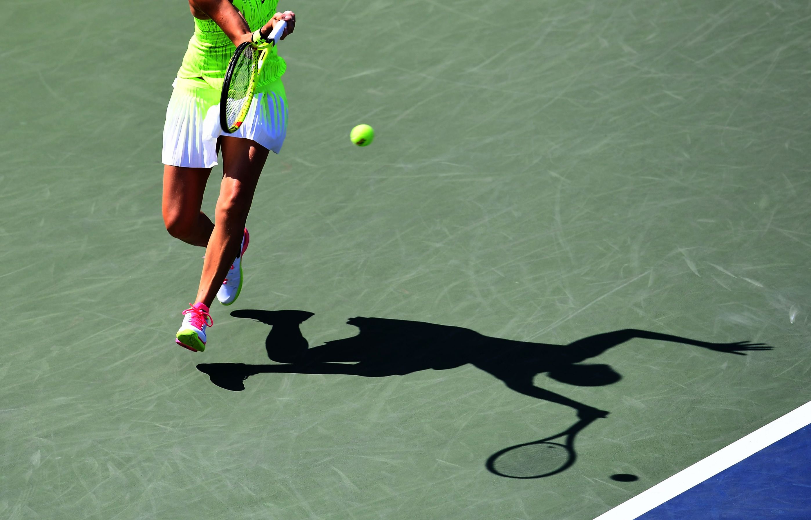 Female-player-action-hard-court.jpg
