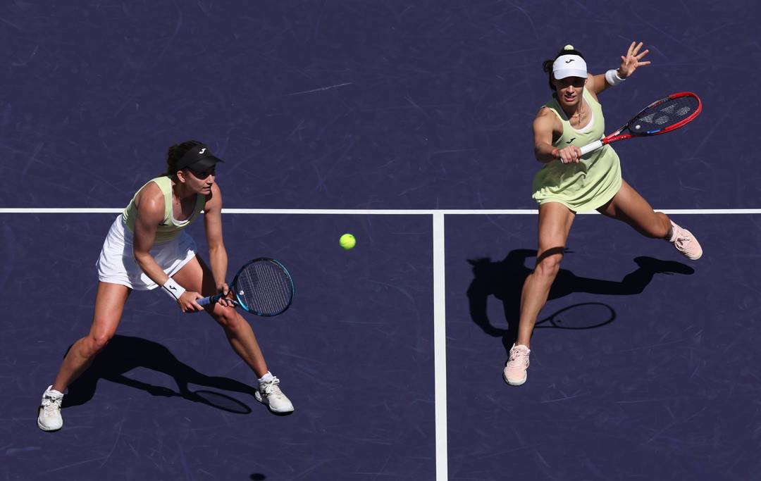 Olivia Nicholls and Tereza Mihalikova in action during the women's doubles final at Indian Wells