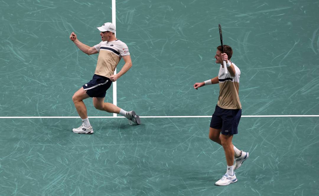 Harri Heliovaara and Henry Patten celebrate winning the Rolex Paris Masters title