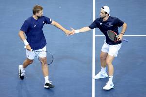 Lloyd Glasspool and Julian Cash high five during Davis Cup action against Norway