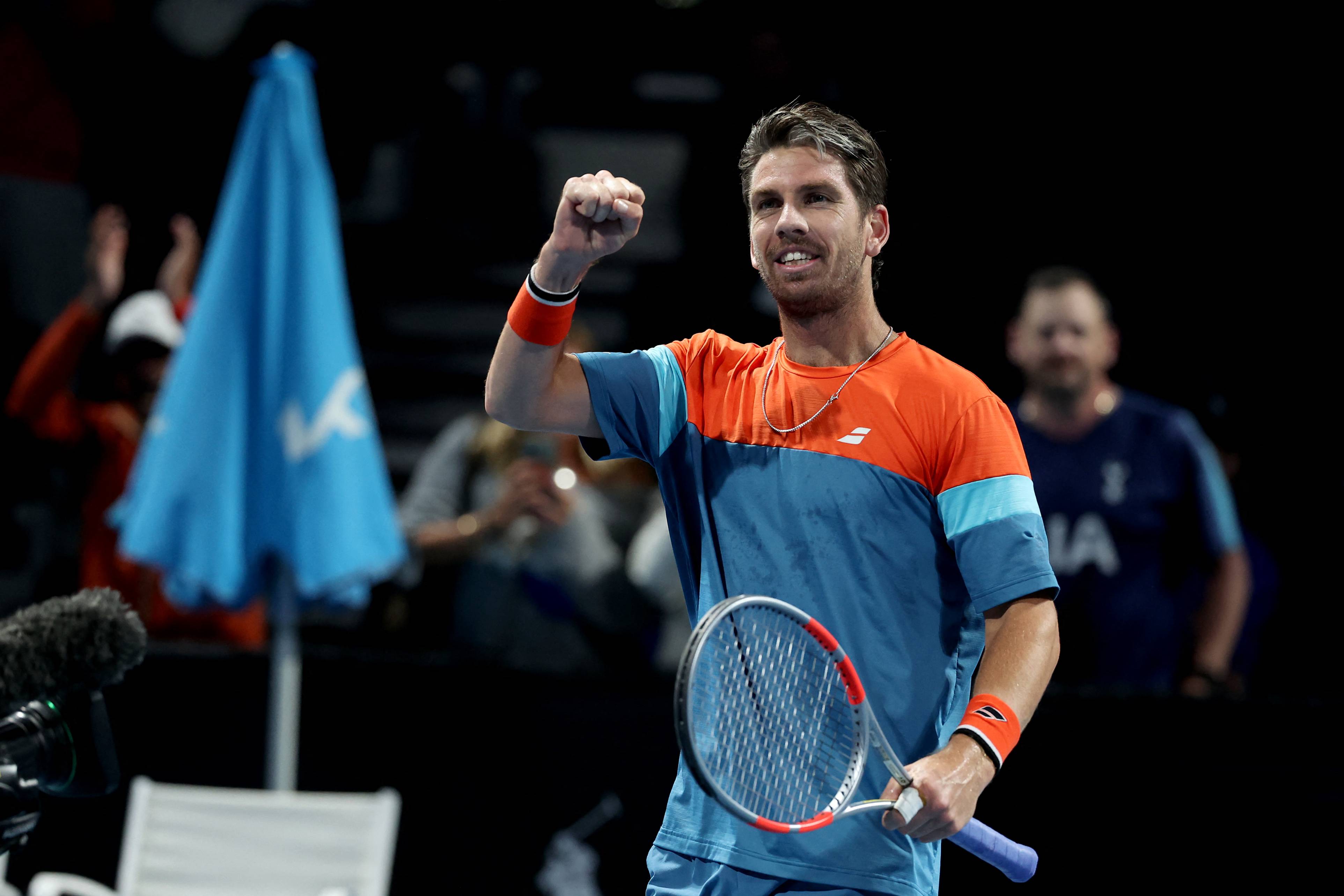 Cam Norrie pumps his fist in celebration to the crowd after a win at the Australian Open