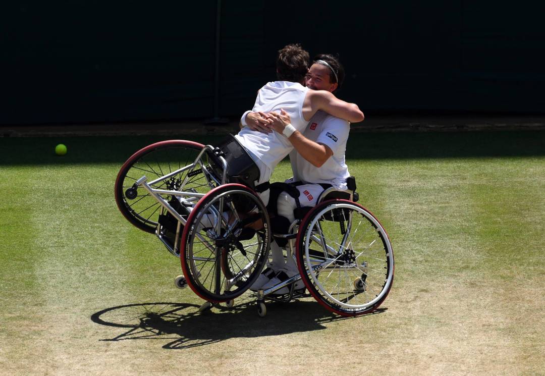 Alfie Hewett hugs Gordon Reid after winning their seventh Wimbledon doubles title in 2026