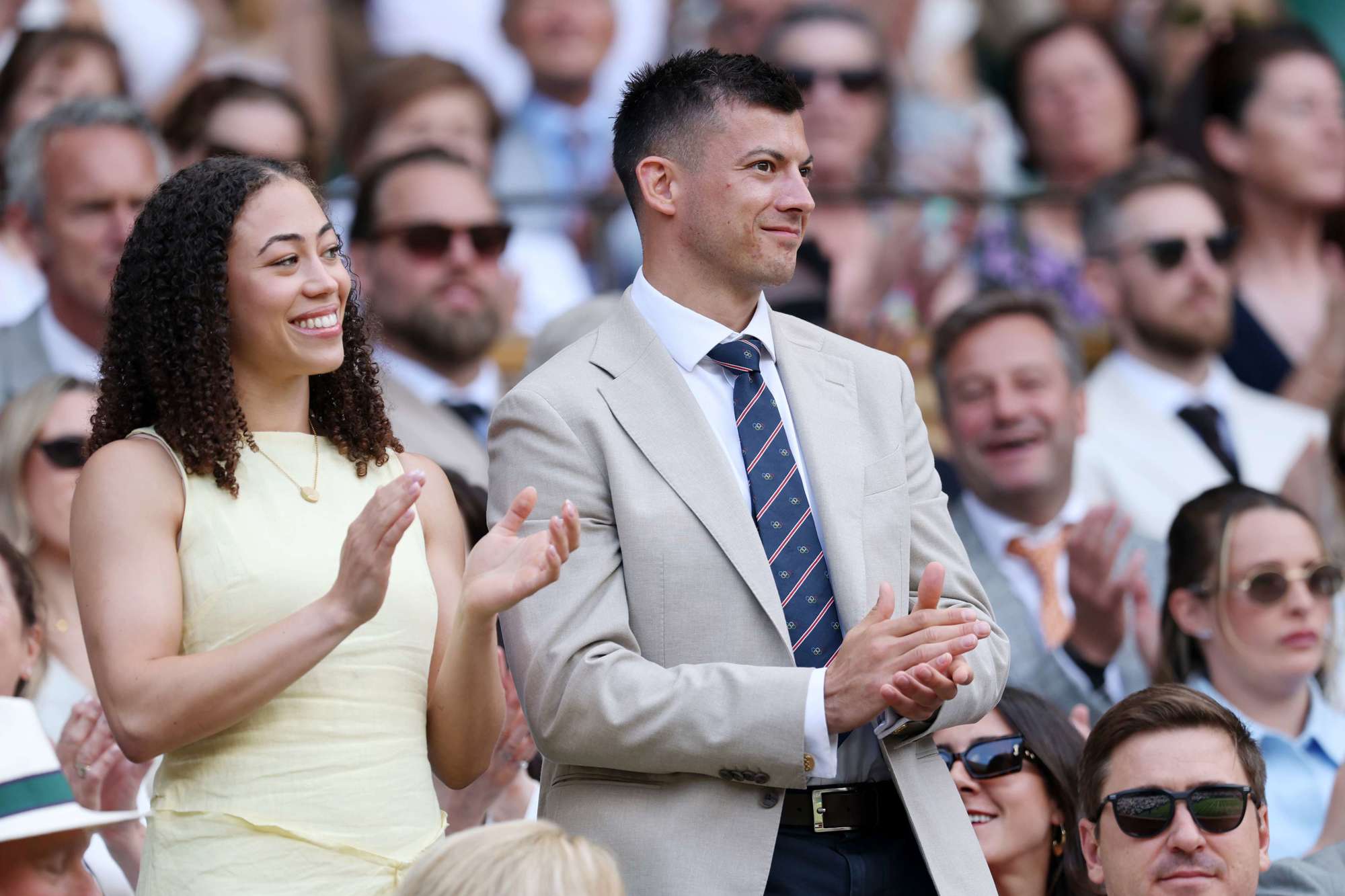Winter Olympics skeleton gold medallists Tabitha Stoeker and Matt Weston stood up clapping in the Royal Box