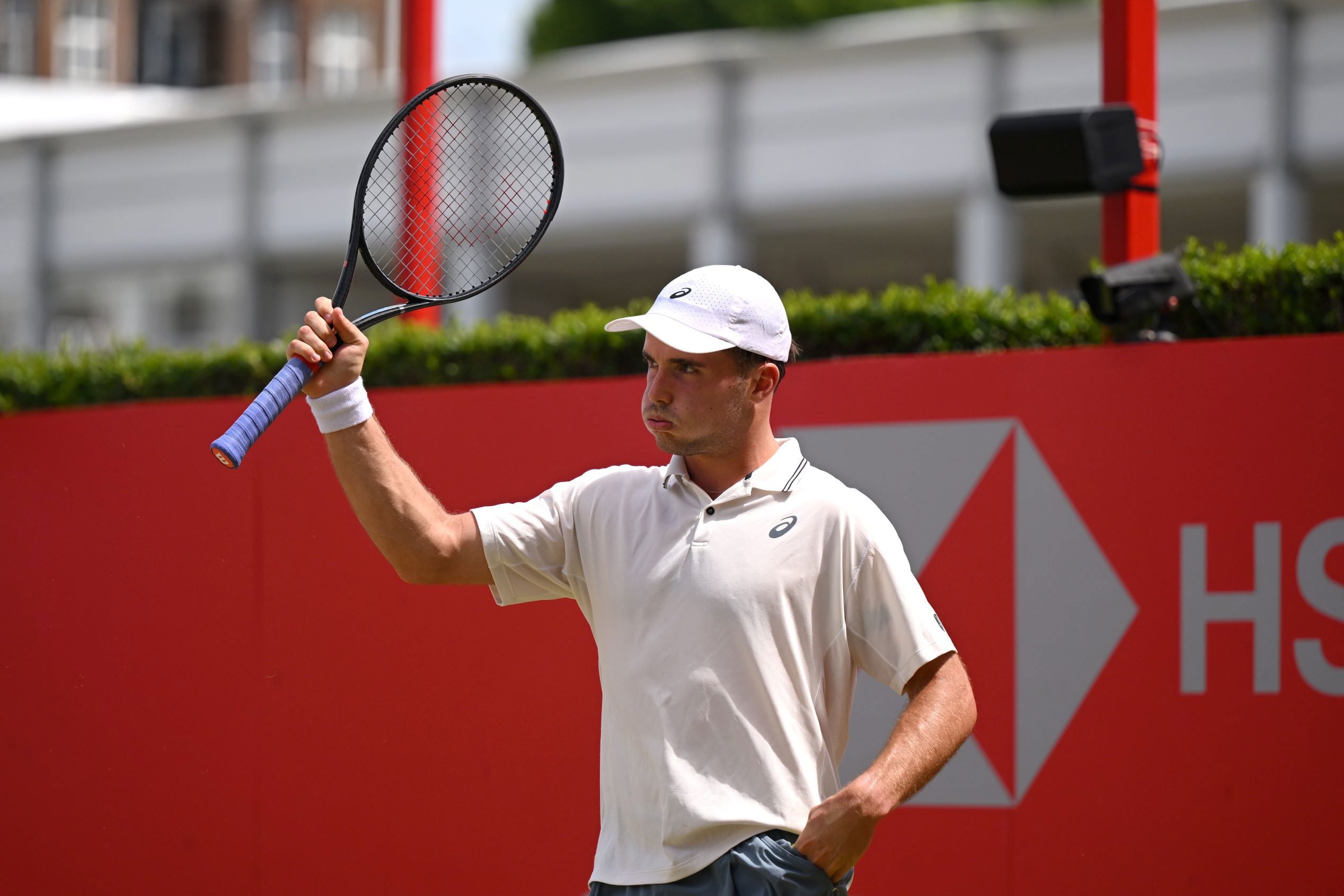Arthur Fery holding his tennis racket up in the air on court at the HSBC Championships