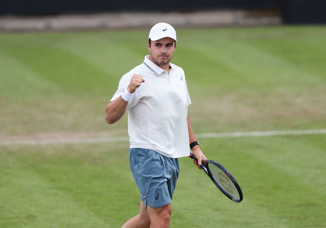 Arthur Fery pumps his fist in celebration after winning a point in the first round of Lexus Birmingham Open