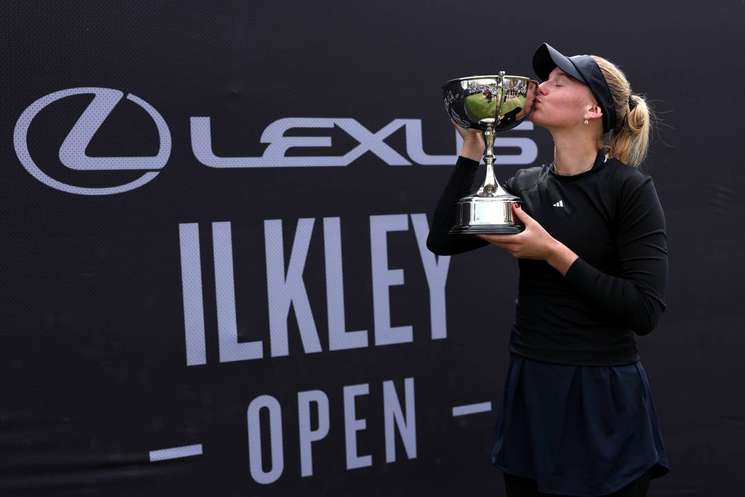 American tennis player Ashlyn Krueger kissing the Lexus Ilkley Open trophy after winning the women's singles title 