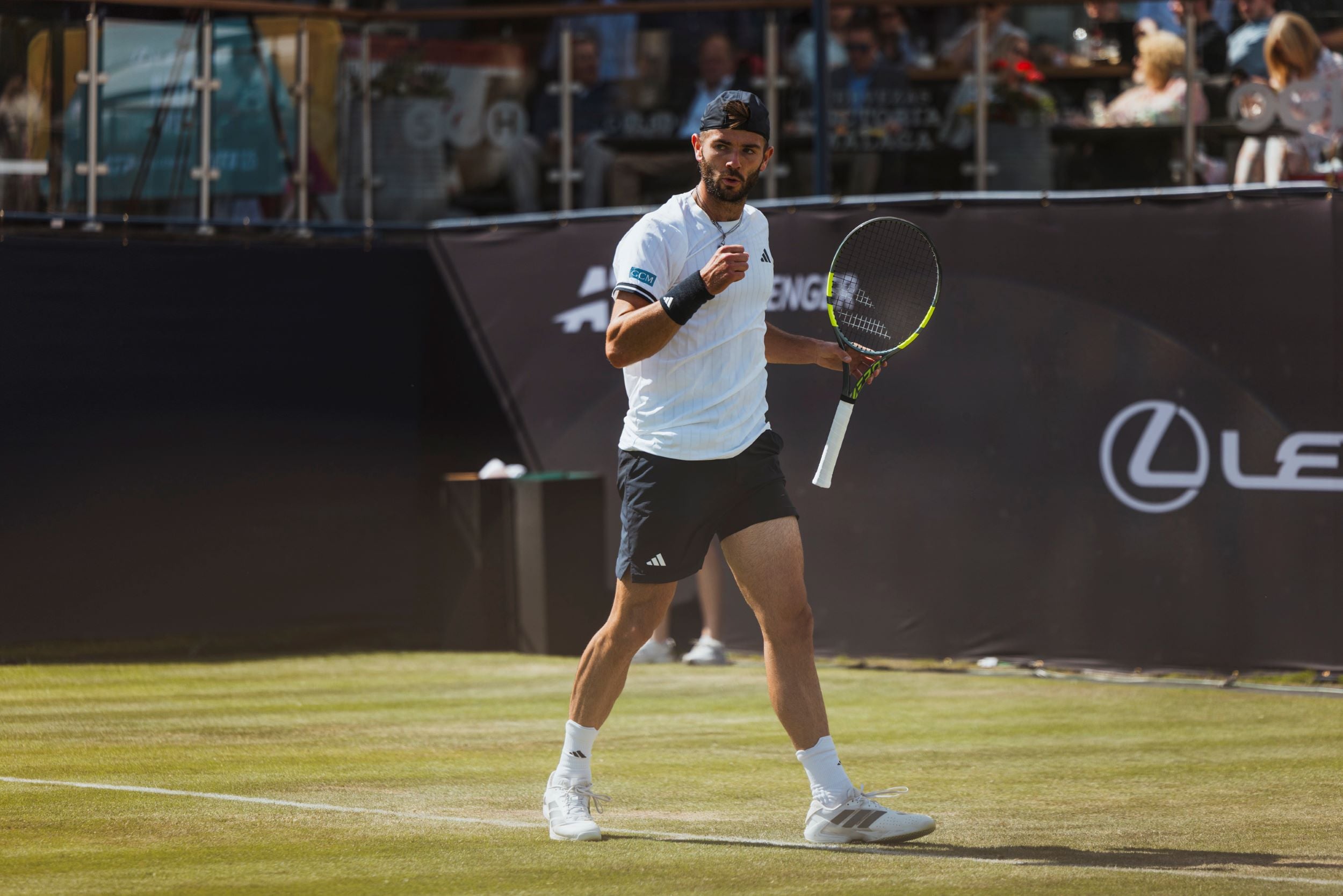 British tennis player Jacob Fearnley pumping his fist in celebration at the Lexus Ilkley Open