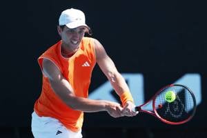 Mark Ceban hits a backhand during Junior Australian Open