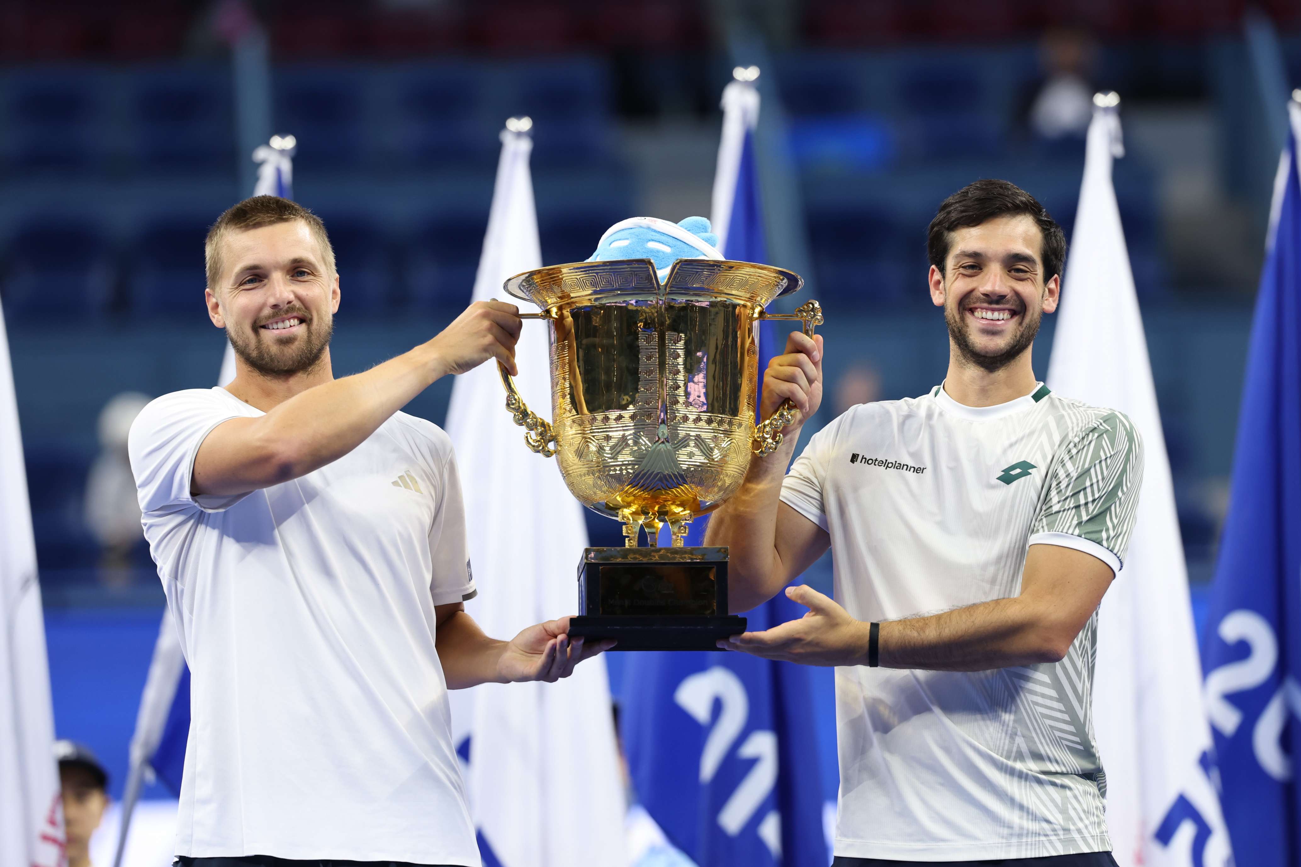 British doubles team Lloyd Glasspool and Julian Cash holding the 2026 Beijing Open title