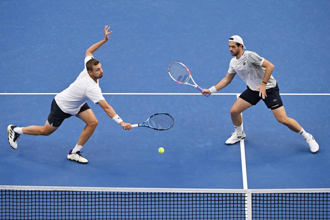 Lloyd Glasspool and Julian Cash in action on court during the Beijing Open