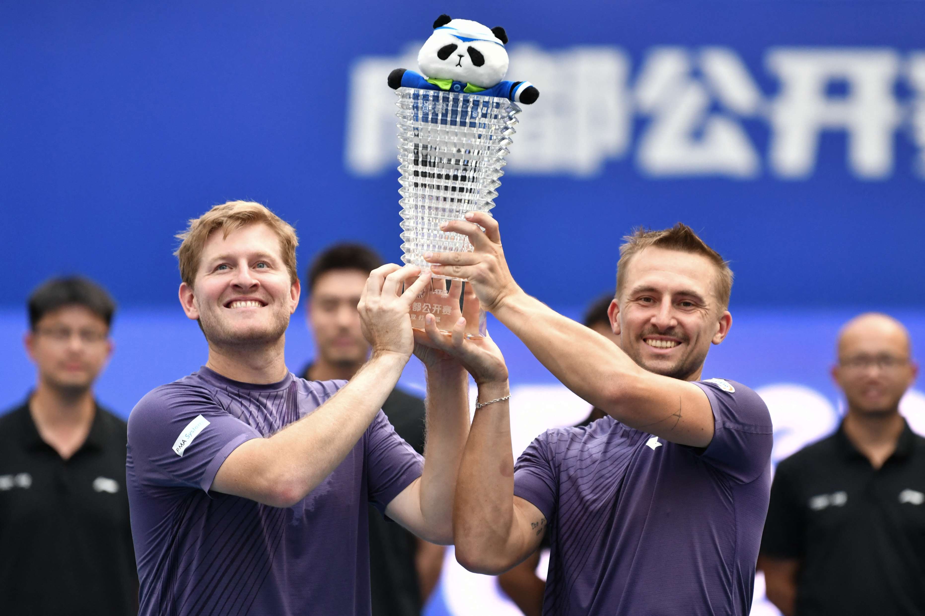 Luke Johnson and Jan Zielinski holding the Chengdu Open doubles title 
