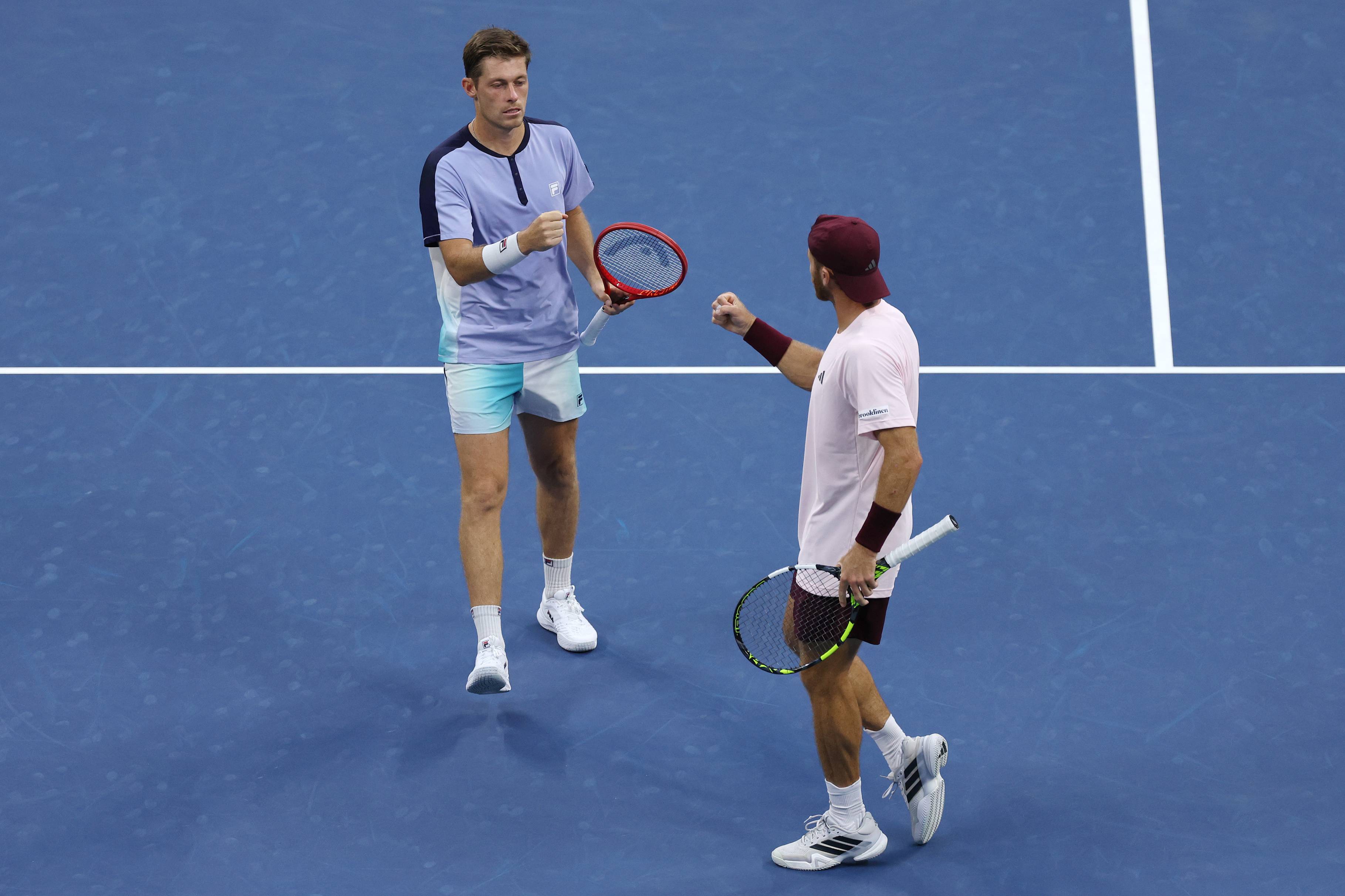 Neal Skupski and Christian Harrison celebrate winning a point in the semi-finals of the men's doubles at the 2026 US Open