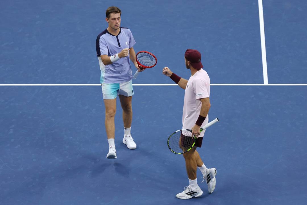 Neal Skupski and Christian Harrison celebrate winning a point in the semi-finals of the men's doubles at the 2026 US Open