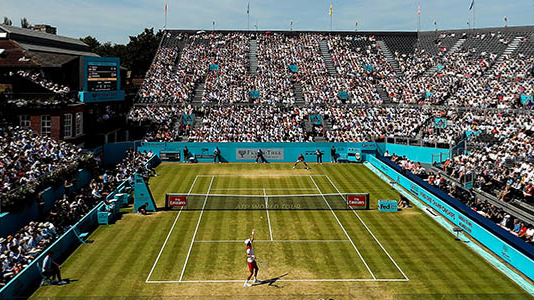 birds eye view of grass courts at fever tree with woman's singles match  being played